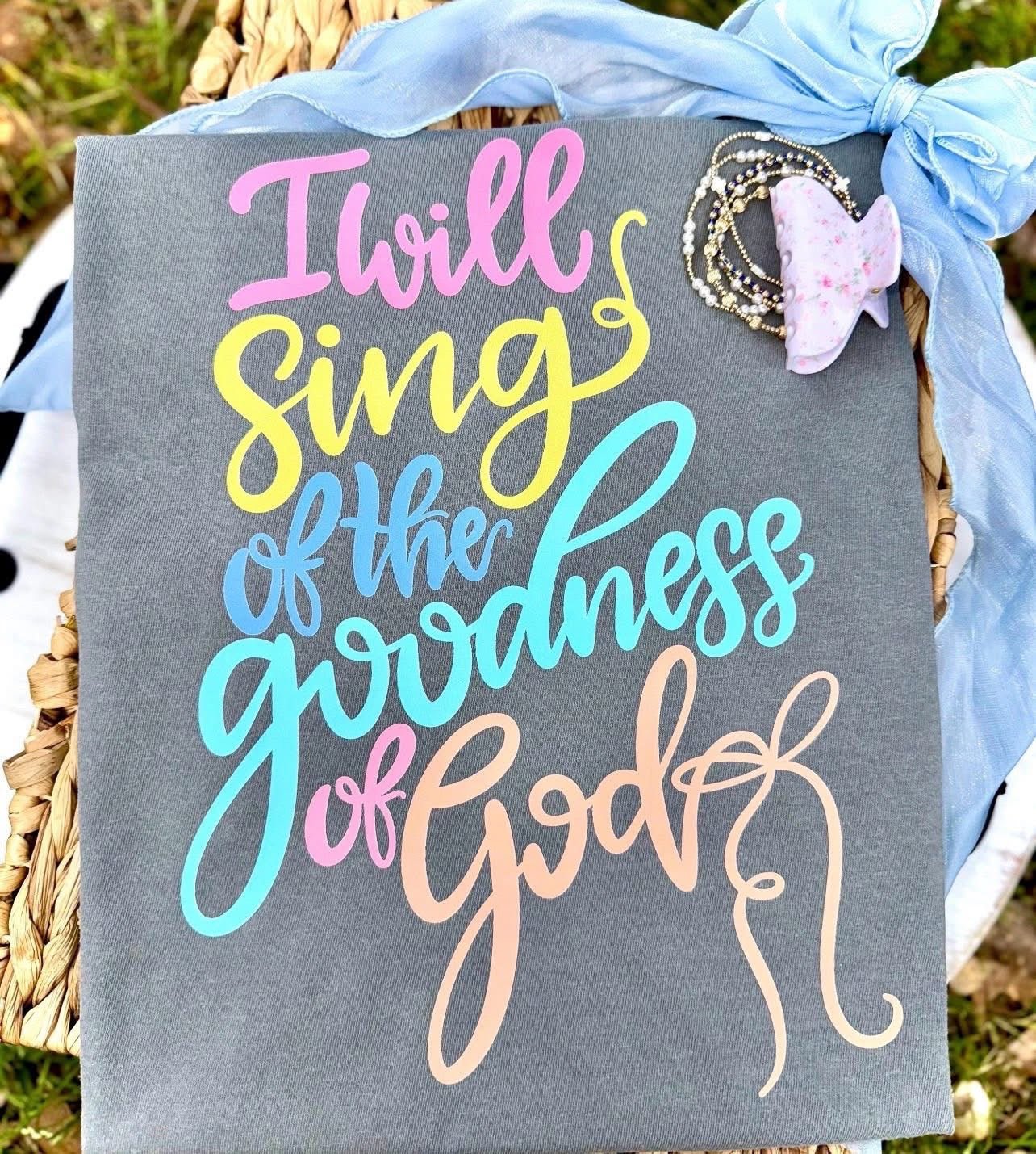 Gray shirt with pastel script text 'I will sing of the goodness of God'